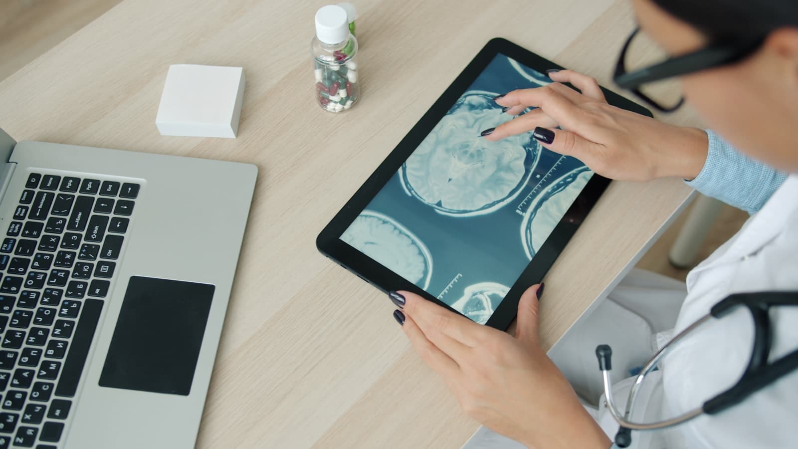 Clinician reviewing patient imaging on a tablet, powered by MedTalk AI